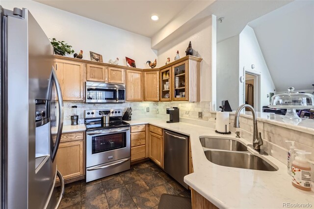 8944 Fox Dr Unit 6-103, Denver, CO 80260 - kitchen with appliances with stainless steel finishes, a sink, tasteful backsplash, glass insert cabinets, and dark stone finish flooring