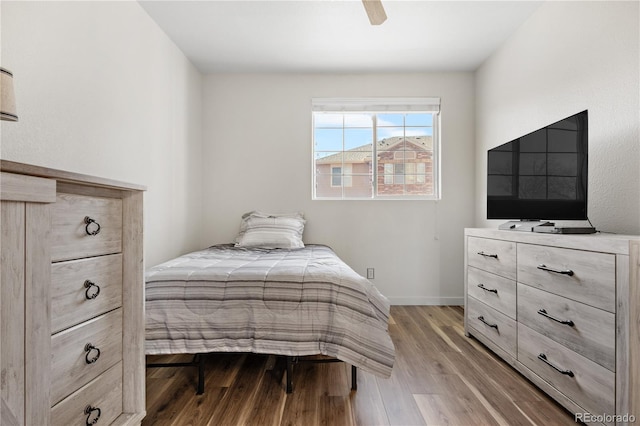 8944 Fox Dr Unit 6-103, Denver, CO 80260 - bedroom with wood finished floors, ceiling fan, and baseboards
