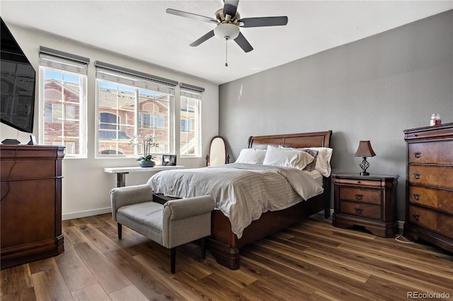8944 Fox Dr Unit 6-103, Denver, CO 80260 - bedroom with wood finished floors, baseboards, and a ceiling fan