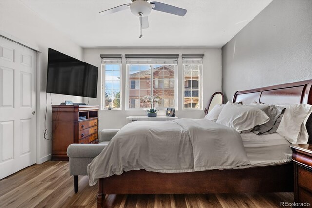 8944 Fox Dr Unit 6-103, Denver, CO 80260 - bedroom featuring wood finished floors and a ceiling fan