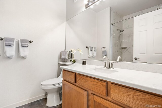 8944 Fox Dr Unit 6-103, Denver, CO 80260 - full bath with vanity, a marble finish shower, toilet, baseboards, and tile patterned floors