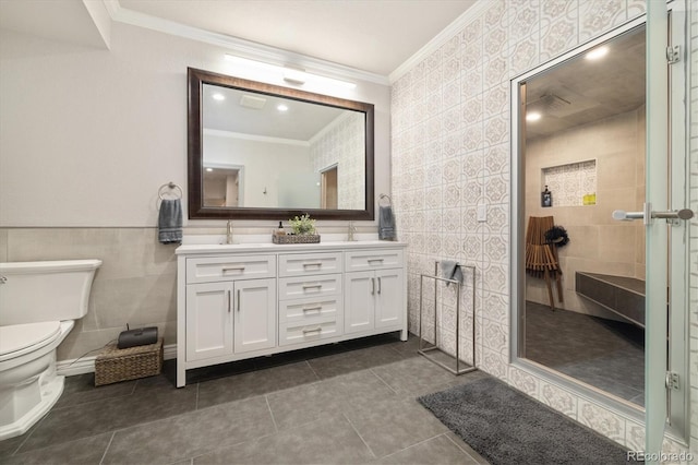 bathroom featuring toilet, ornamental molding, tile walls, and tile patterned floors