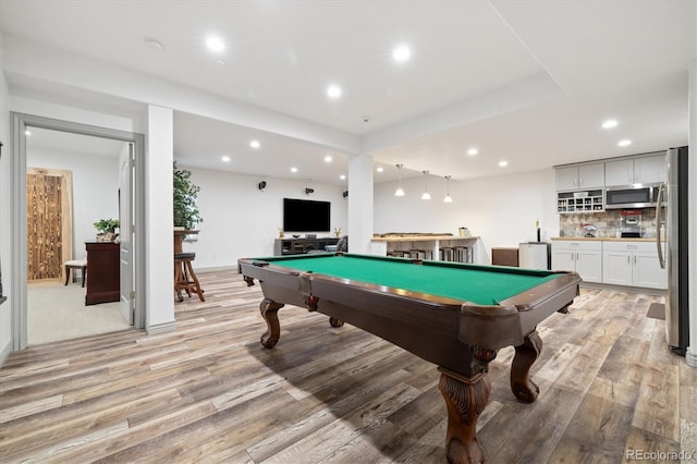 recreation room with pool table, light wood finished floors, indoor wet bar, and recessed lighting