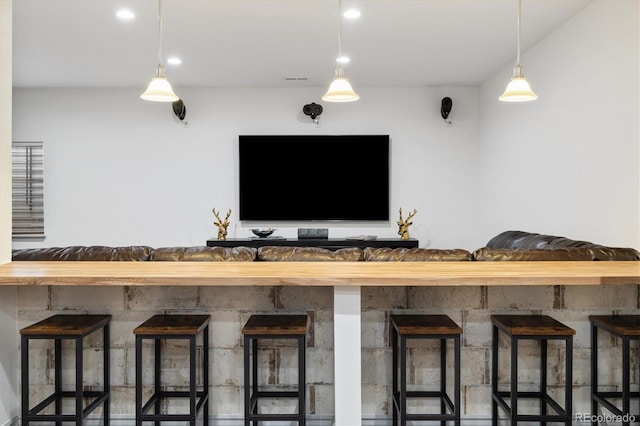 bar featuring decorative light fixtures