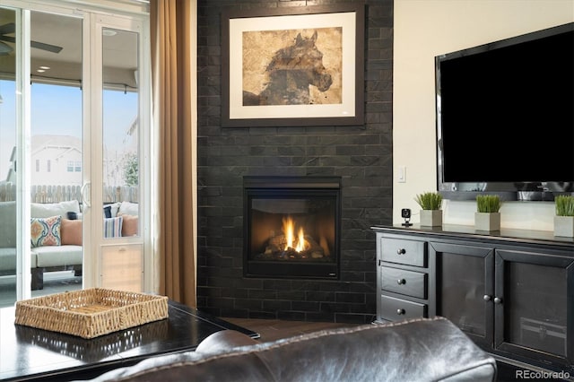 living room featuring a glass covered fireplace