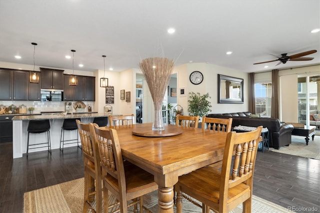 dining room with ceiling fan, dark wood-style flooring, and recessed lighting