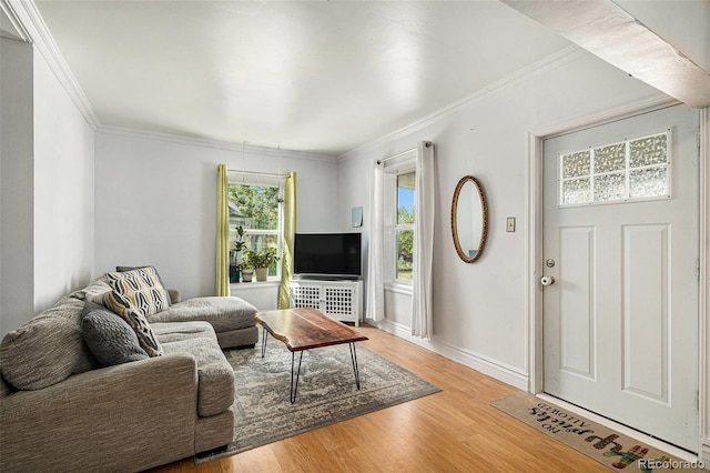 3768 S Acoma St, Englewood, CO 80110 - living area featuring crown molding, baseboards, and light wood-style flooring