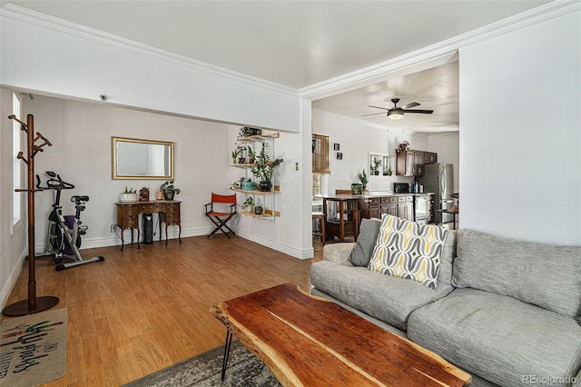 3768 S Acoma St, Englewood, CO 80110 - living room featuring crown molding, baseboards, ceiling fan, and wood finished floors