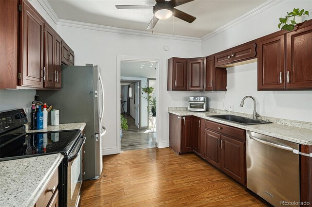 3768 S Acoma St, Englewood, CO 80110 - kitchen with crown molding, electric range, ceiling fan, a sink, and stainless steel dishwasher
