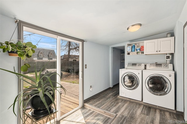 3768 S Acoma St, Englewood, CO 80110 - laundry area with dark wood-type flooring, cabinet space, and washing machine and clothes dryer