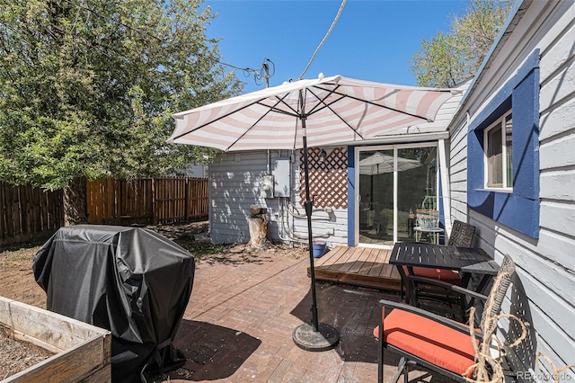 3768 S Acoma St, Englewood, CO 80110 - view of patio featuring fence, outdoor dining space, and grilling area