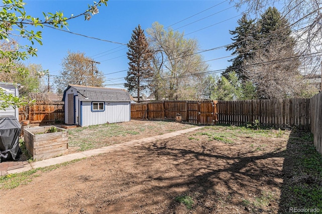 3768 S Acoma St, Englewood, CO 80110 - view of yard with a fenced backyard, a storage unit, an outdoor structure, and a vegetable garden