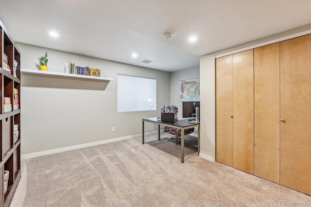 office area featuring light colored carpet