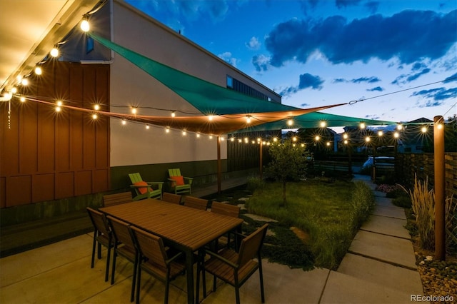 view of patio terrace at dusk