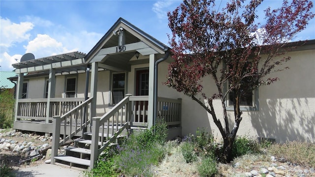 150 Palmer Ave, Poncha Springs, CO 81242 - view of front of home with stucco siding and a porch
