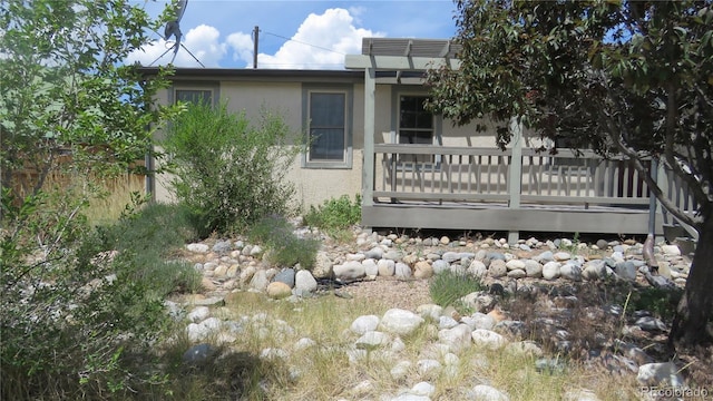 150 Palmer Ave, Poncha Springs, CO 81242 - view of home's exterior with stucco siding and a deck