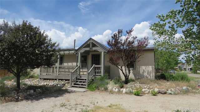 150 Palmer Ave, Poncha Springs, CO 81242 - view of front of property with stucco siding and covered porch