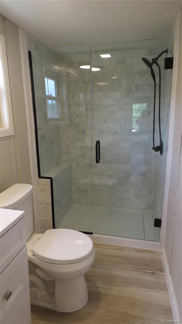150 Palmer Ave, Poncha Springs, CO 81242 - bathroom featuring wood finished floors, a stall shower, and vanity