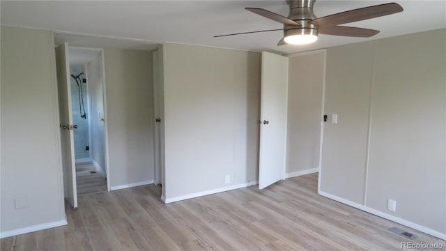 150 Palmer Ave, Poncha Springs, CO 81242 - unfurnished bedroom with light wood finished floors, a closet, and a ceiling fan
