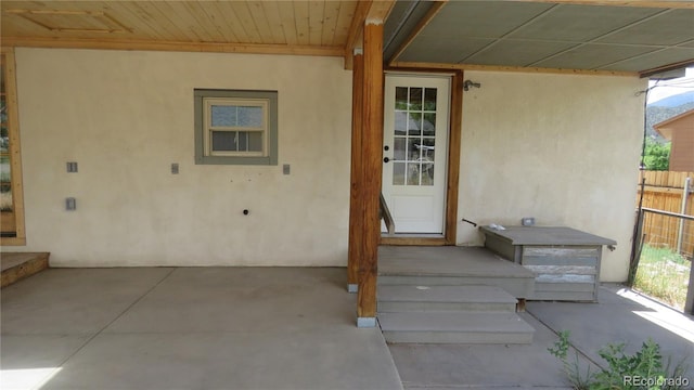 150 Palmer Ave, Poncha Springs, CO 81242 - view of exterior entry featuring stucco siding and a patio area