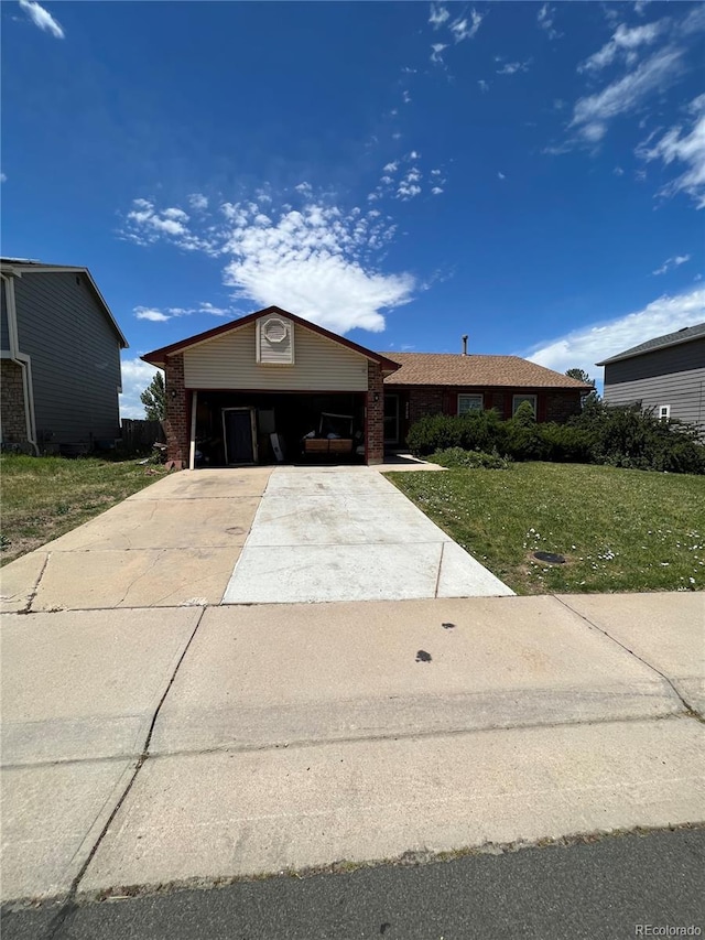 ranch-style house with a carport and a front yard