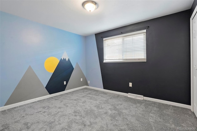 unfurnished room featuring carpet flooring