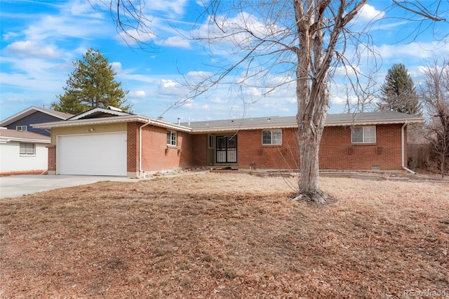 ranch-style house with a garage and a front lawn