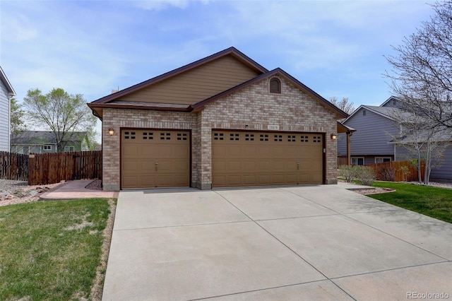 ranch-style home with fence, brick siding, driveway, and an attached garage