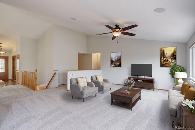 living room featuring carpet floors, ceiling fan, healthy amount of natural light, high vaulted ceiling, and baseboards