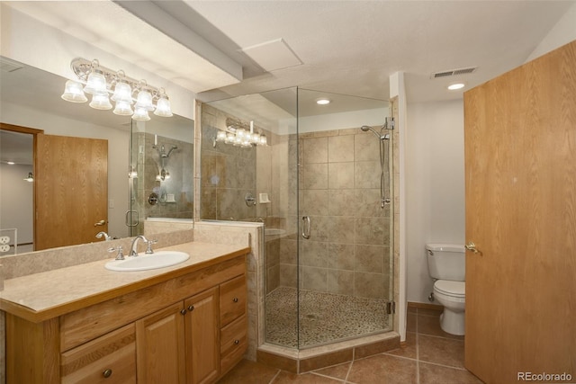 full bath featuring tile patterned flooring, toilet, a stall shower, vanity, and recessed lighting