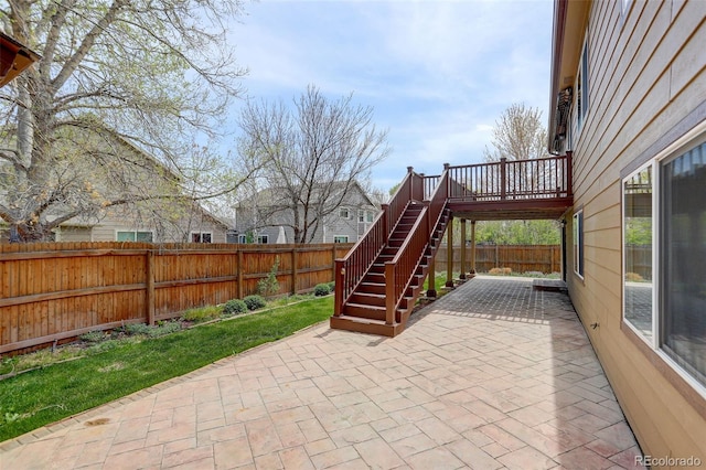 view of patio featuring a fenced backyard and stairs