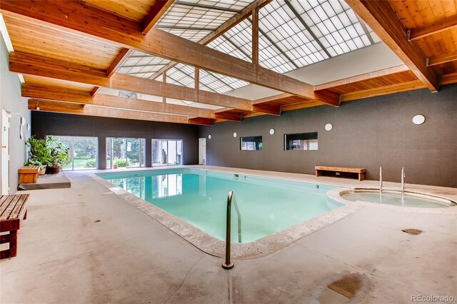 pool with an indoor in ground hot tub
