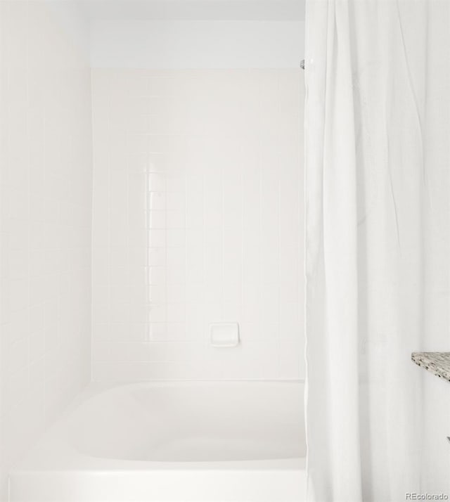 5282 E 116th Ave, Thornton, CO 80233 - bathroom with shower / tub combo with curtain