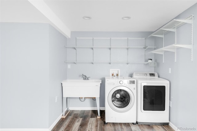 5282 E 116th Ave, Thornton, CO 80233 - washroom with washer and clothes dryer and dark wood finished floors
