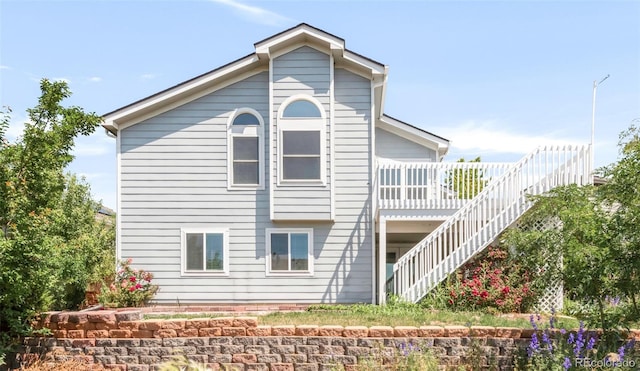 5282 E 116th Ave, Thornton, CO 80233 - back of property with stairs and a wooden deck