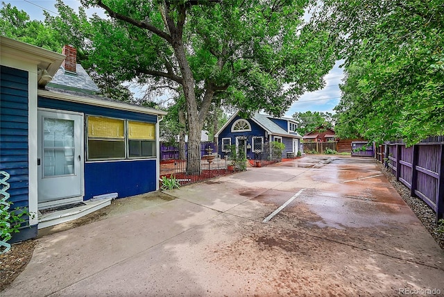 view of patio featuring fence