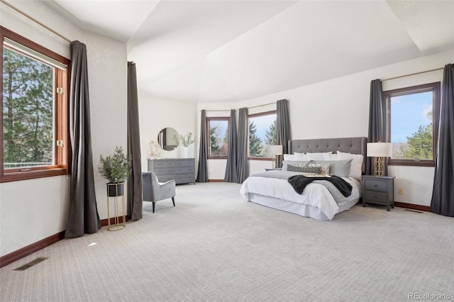 carpeted bedroom with baseboards, multiple windows, and visible vents