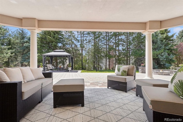 view of patio featuring an outdoor living space and a gazebo