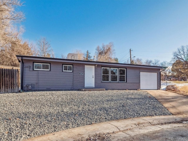 ranch-style house featuring a garage