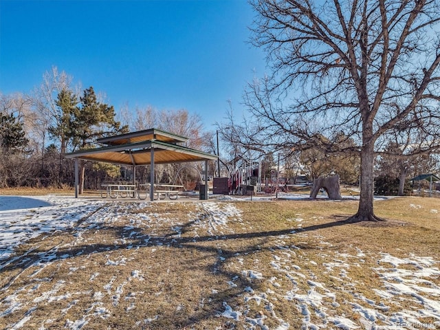 yard layered in snow featuring a gazebo