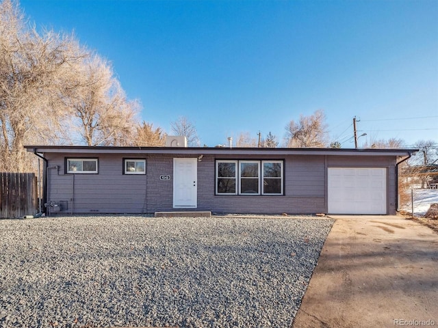 ranch-style home featuring a garage