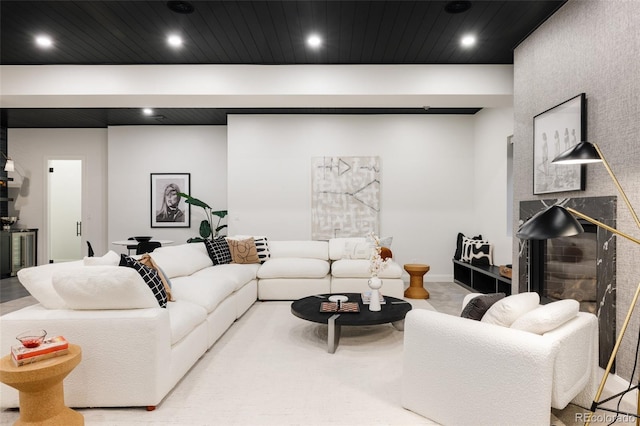 living room featuring wooden ceiling and recessed lighting