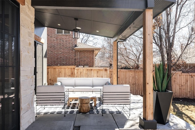 view of patio / terrace with a fenced backyard and an outdoor living space