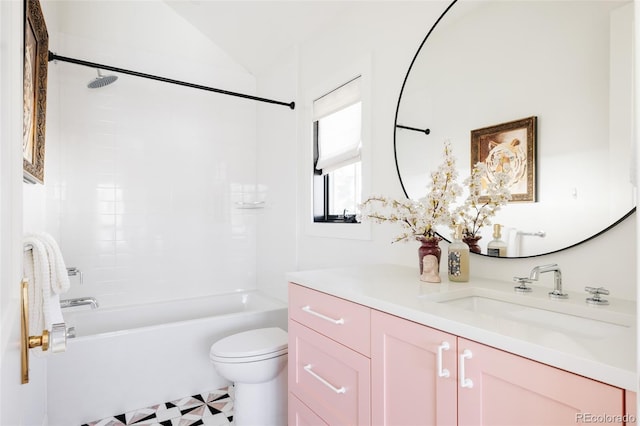 bathroom with vaulted ceiling, shower / bathing tub combination, vanity, and toilet