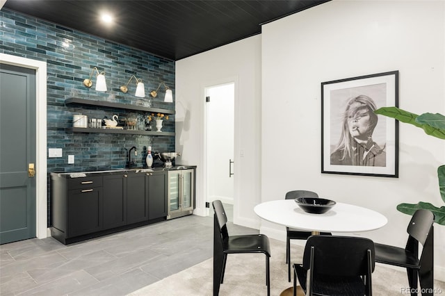 interior space with wet bar, wooden ceiling, and wine cooler