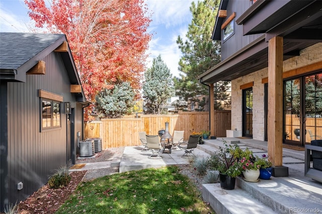 view of yard with fence and a patio