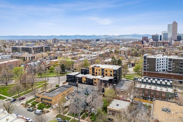 property's view of city featuring a mountain view
