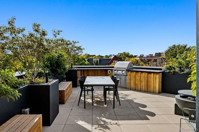 view of patio featuring area for grilling and outdoor dining area