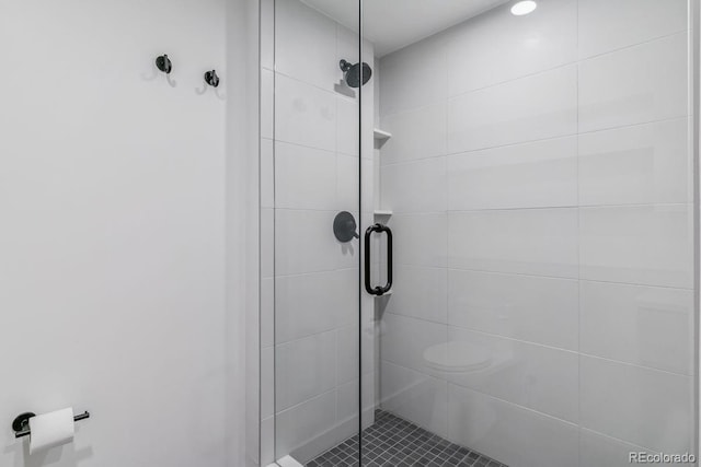full bath with a shower stall