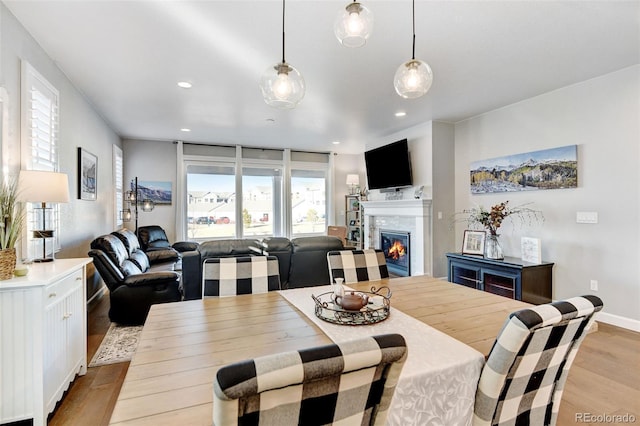 dining space with light hardwood / wood-style floors